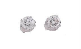 A PAIR OF SINGLE STONE DIAMOND EAR STUDS