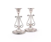 A PAIR OF LATE VICTORIAN SILVER CANDLESTICKS