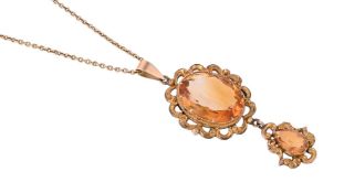 A CITRINE DROP PENDANT ON CHAIN