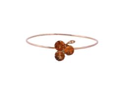 A LATE VICTORIAN CITRINE AND ROSE CUT DIAMOND CLOVER BANGLE