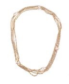 A GOLD COLOURED AND PEARL LONG CHAIN