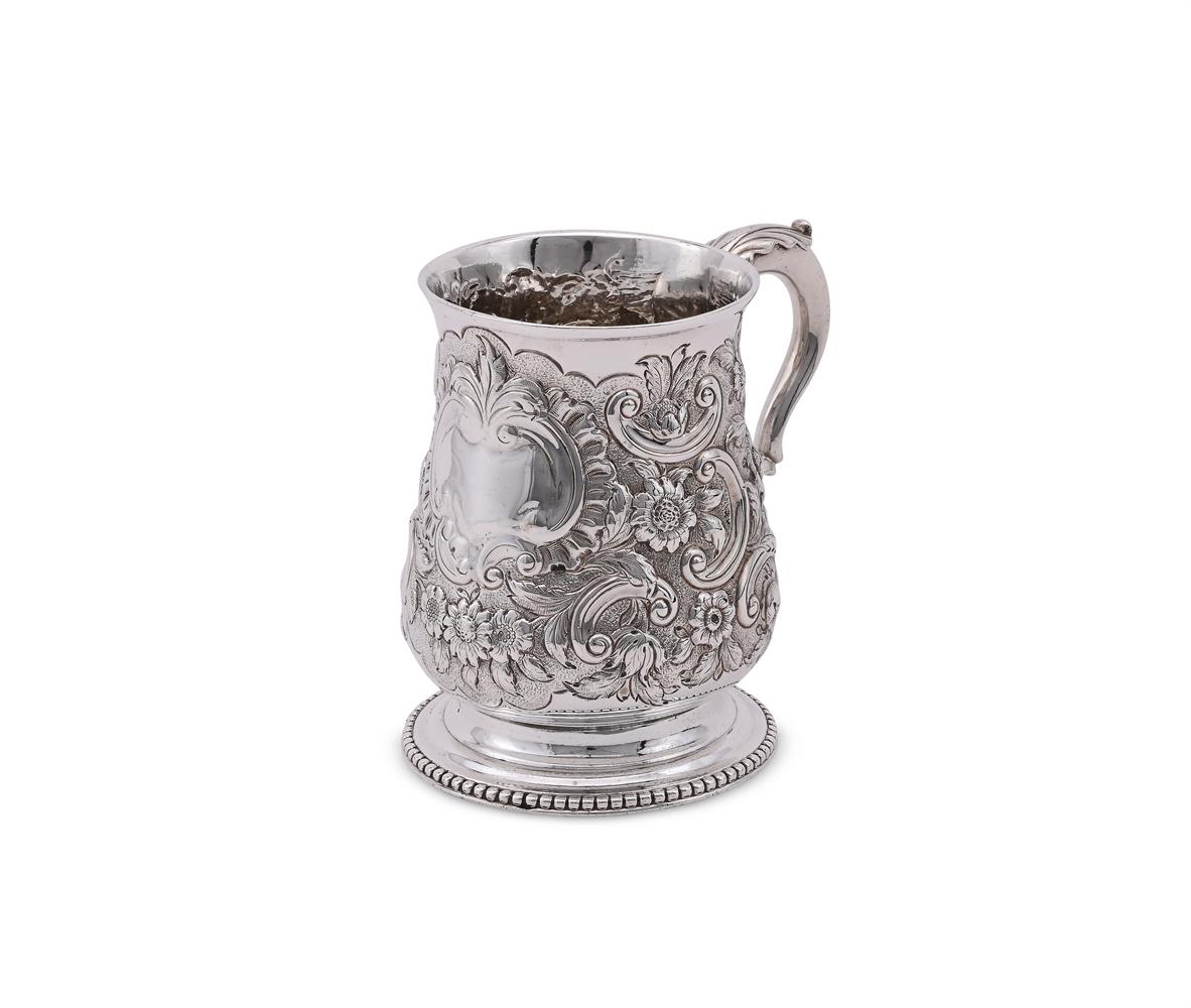 A GEORGE III SILVER BALUSTER MUG