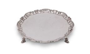 A SILVER SHAPED CIRCULAR SALVER