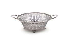 A SILVER CIRCULAR TWIN HANDLED BASKET