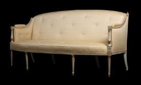 A PAINTED AND PARCEL GILT SOFA IN REGENCY STLE
