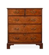A GEORGE III MAHOGANY AND CROSSBANDED CHEST OF DRAWERS IN THE MANNER OF THOMAS CHIPPENDALE