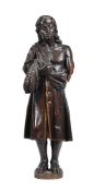 A CARVED AND STAINED OAK FIGURE OF A RUSTIC MALE FIGURE