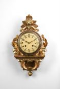 A SWEDISH GILTWOOD CARTEL WALL CLOCK IN 19TH CENTURY STYLE