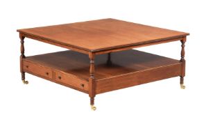 A MAHOGANY LOW OCCASIONAL TABLE IN REGENCY STYLE