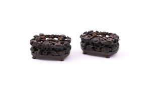A pair of Chinese carved and silver wire-inlaid zitan stands
