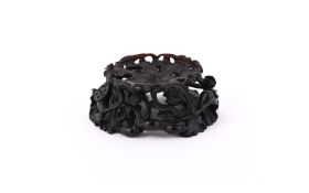 A Chinese carved wood stand