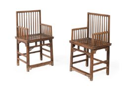 A pair of Chinese hardwood armchairs