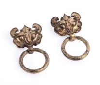 A pair of Chinese gilt bronze taotie handles with suspending rings