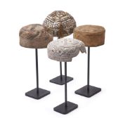 FOUR METAL THREAD MUSLIM HATS ON LATER METAL STANDS, CIRCA 1980
