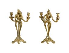 A PAIR OF GILT METAL THREE LIGHT CANDELABRA