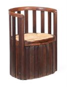 AN ARTS AND CRAFTS OAK AND BEECH 'BARREL' ARMCHAIR, CIRCA 1900