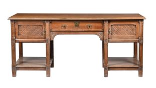A LATE VICTORIAN ARTS & CRAFTS OAK SIDEBOARD
