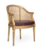 A LOUIS XVI CARVED GILTWOOD FAUTEUIL DE BUREAU OR ARMCHAIR, ATTRIBUTED TO NICOLAS-LOUIS MARIETTE