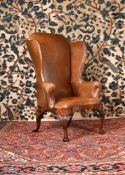 A GEORGE I WALNUT WING ARMCHAIR, CIRCA 1725