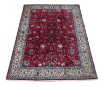 A TABRIZ CARPET, SIGNED BY MASTER WEAVER JAVAN AMIR KHIZ, approximately 400 x 282cm