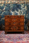 A CHARLES II OLIVEWOOD, WALNUT, FRUITWOOD OYSTER VENEERED AND MARQUETRY CHEST OF DRAWERS, CIRCA 1680