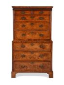 A FINE GEORGE II BURR WALNUT SECRETAIRE CHEST ON CHESTIN THE MANNER OF GILES GRENDEY