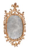 A GEORGE III CARVED GILTWOOD OVAL MIRROR, CIRCA 1770