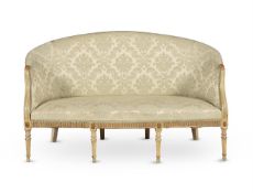 A GEORGE III CREAM PAINTED AND PARCEL GILT SOFA, CIRCA 1780