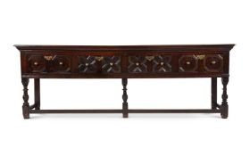 A LARGE CHARLES II OAK DRESSER BASE, CIRCA 1680