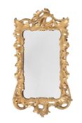 A SIMILAR EARLY GEORGE III CARVED GILTWOOD WALL MIRROR, CIRCA 1760