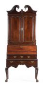 AN IRISH GEORGE II MAHOGANY BUREAU CABINET, CIRCA 1760