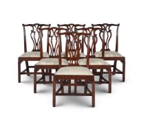 A SET OF SIX GEORGE III MAHOGANY DINING CHAIRS, IN THE MANNER OF THOMAS CHIPPENDALE, CIRCA 1770