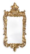 A GEORGE III GILTWOOD CARVED WALL MIRROR, CIRCA 1760