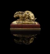 ANTOINE-LOUIS BARYE (FRENCH, 1795-1875), A GILT BRONZE MODEL OF A CROUCHING RABBIT