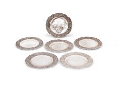 A SET OF SIX PERSIAN SILVER SHAPED CIRCULAR PLATES