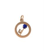CARTIER, A LAPIS LAZULI AND GOLD COLOURED KEY PENDANT