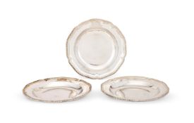 A SET OF THREE VICTORIAN SILVER SHAPED CIRCULAR SOUP PLATES