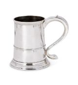 A GEORGE III SILVER TANKARD