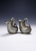 A MATCHED PAIR OF VICTORIAN SILVER ASKOS JUGS