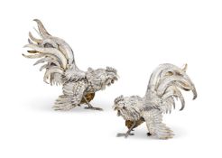 A PAIR OF GERMAN SILVER AND SILVER GILT FIGURES OF COCKERELS