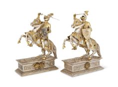 A PAIR OF SILVER AND SILVER GILT MODELS OF KNIGHTS ON HORSEBACK