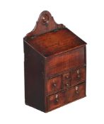 A SMALL OAK HANGING WALL CUPBOARD