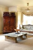 A LARGE VARIEGATED GREEN MARBLE LOW CENTRE TABLE