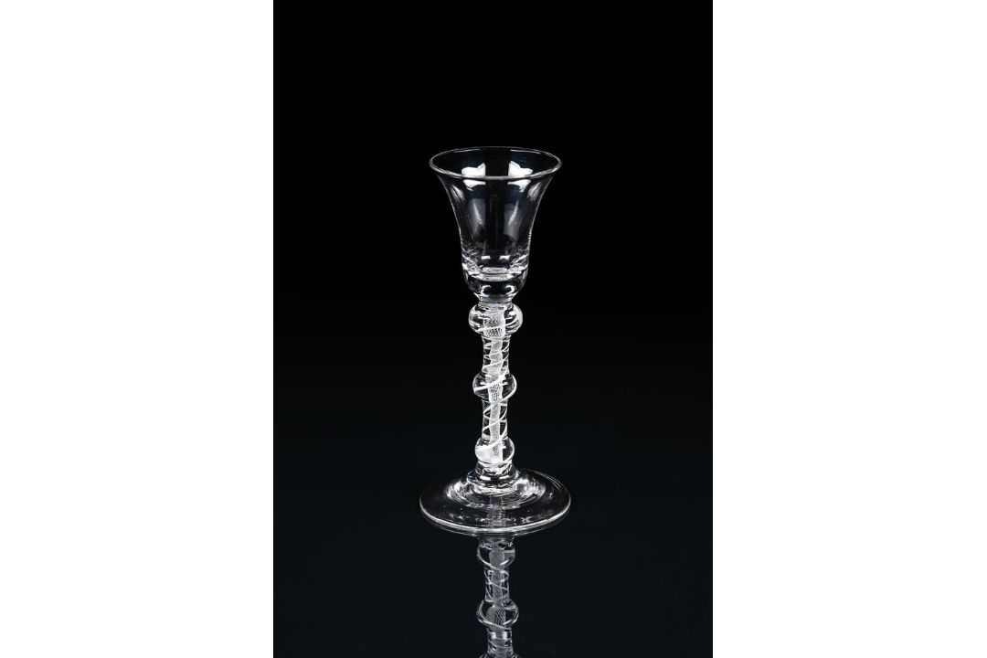 AN OPAQUE-TWIST TRIPLE-KNOPPED WINE GLASS