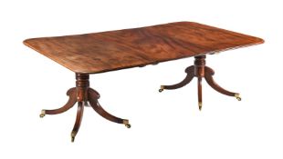 A REGENCY MAHOGANY TWIN PEDESTAL DINING TABLE