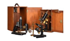 A BLACK JAPANNED MONOCULAR COMPOUND MICROSCOPE