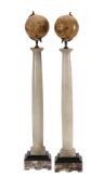 A PAIR OF DECORATIVE SMALL TABLE GLOBES ON ALABASTER AND MARBLE COLUMN STANDS