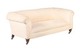A LATE VICTORIAN UPHOLSTERED SOFA
