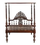 A MID VICTORIAN HARDWOOD FOUR POST BED