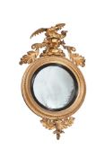 A GILTWOOD CONVEX WALL MIRROR